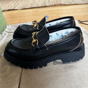 Gucci Black Leather Loafers with Gold Accents